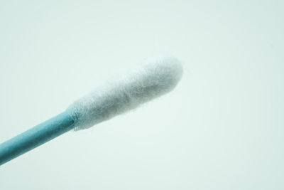 Low angle view of smoke against white background