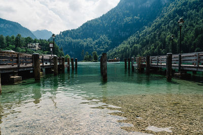 Pier over lake against mountains