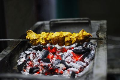 Close-up of meat on barbecue grill