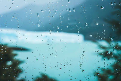 Full frame shot of wet glass window