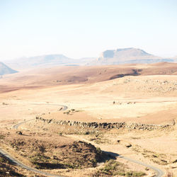 Scenic view of desert against clear sky