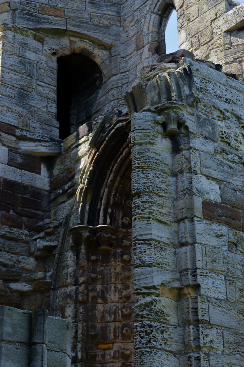 LOW ANGLE VIEW OF ABANDONED BUILDING