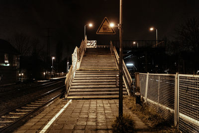 Empty railroad station platform at night