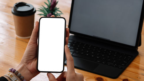 High angle view of mobile phone on table