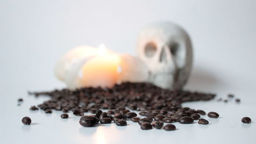 Close-up of coffee beans against white background