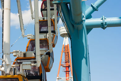 Low angle view of ferris wheel against sky