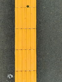 High angle view of yellow lines on road