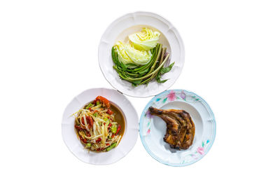 High angle view of food on table against white background