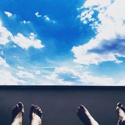 Low section of person relaxing in sky