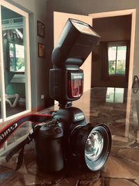 Close-up of camera on table at home