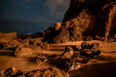 Scenic view of sea against sky at night