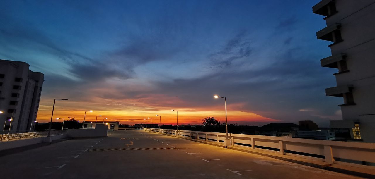 ROAD AGAINST SKY DURING SUNSET