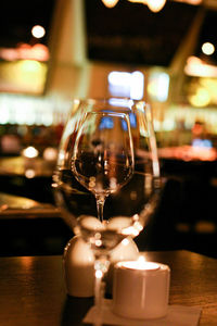 Close-up of wine glasses on table