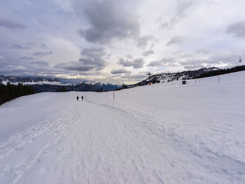 Scenic view of snow covered mountain against sky