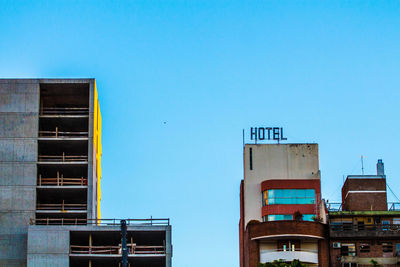 Low angle view of building against blue sky