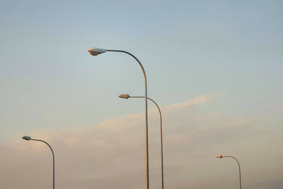 Low angle view of street light against sky