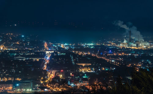 High angle view of illuminated buildings in city at night