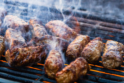 Close-up of meat on barbecue grill