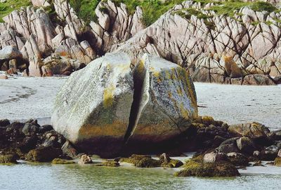 Scenic view of rocks by sea