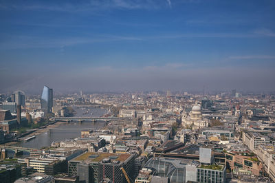 High angle view of illuminated city buildings against sky