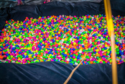 High angle view of multi colored candies for sale in market