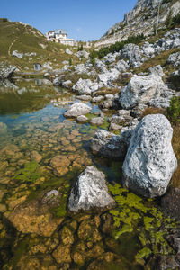 Scenic view of lake against rock formation