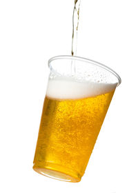 Close-up of beer glass against white background