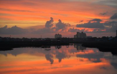 Scenic view of lake against romantic sky at sunset