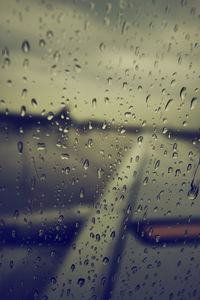 Full frame shot of raindrops on glass window