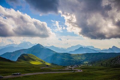 Scenic view of mountains against cloudy sky