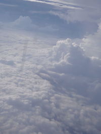 Aerial view of landscape against cloudy sky