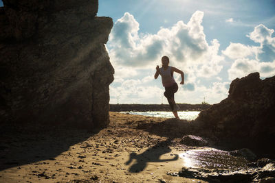 Woman running at beach