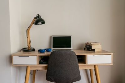 Electric lamp on table at home