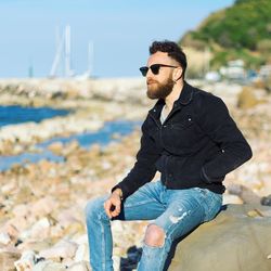 Man sitting by the beach