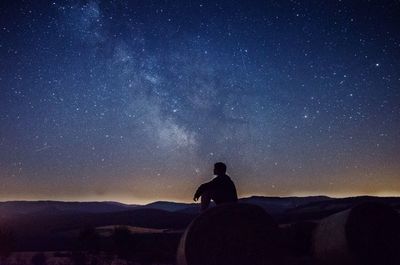 Silhouette of people standing on landscape