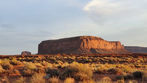 Rock formations on landscape against sky