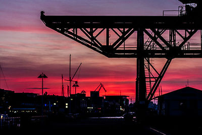 Silhouette of built structure against sky at sunset