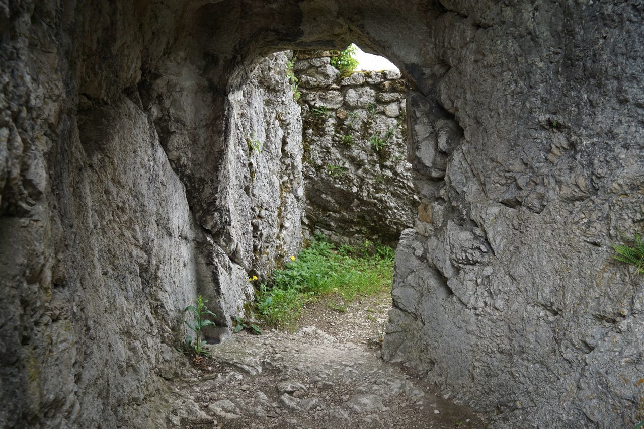 SCENIC VIEW OF CAVE SEEN THROUGH ARCH