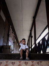 Full length portrait of boy sitting