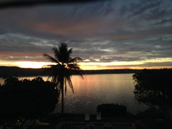 Scenic view of lake against cloudy sky