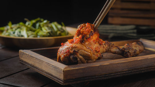 Close-up of meat on barbecue grill