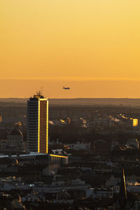 View of city against sky during sunset