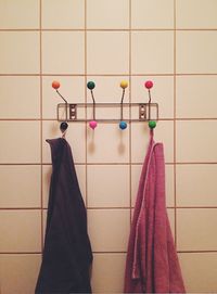 Towels hanging from hooks on wall