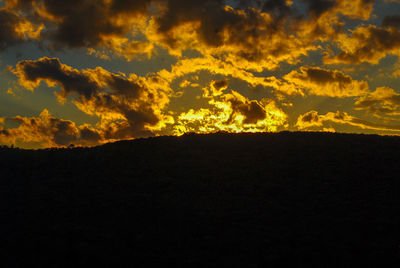 Low angle view of dramatic sky during sunset