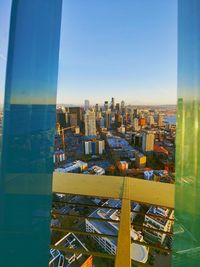 Aerial view of buildings against clear sky