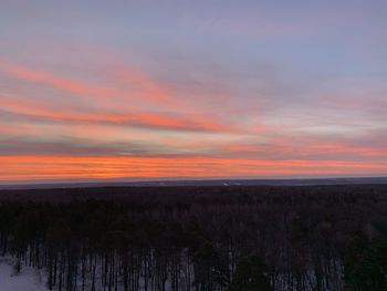 Scenic view of land against sky during sunset
