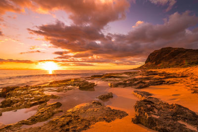 Scenic view of sea against sky during sunset