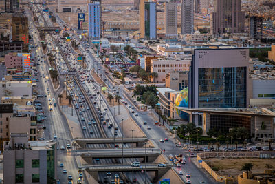 High angle view of vehicles on road along built structures