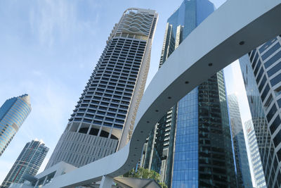 Low angle view of modern buildings against sky in city