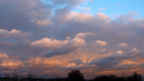 Low angle view of dramatic sky during sunset